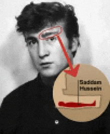 a black and white photo of a man 's face with a red arrow pointing to his forehead .