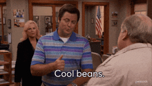 a man giving a thumbs up with the words cool beans behind him