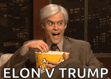 a man in a suit is holding a bucket of popcorn and says elon v trump on the bottom