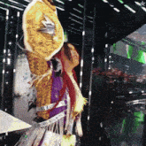 a woman in a colorful costume holds up a purse that says nike on it