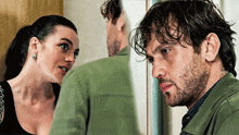 a man and a woman looking at each other