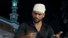 a man with a bandaged head is holding a rope .