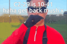a man wearing sunglasses and a red shirt with the words c2-29 is 10 41 haha get back mush x