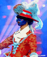 a man is wearing a blue mask and a red hat