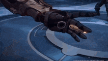 a video game character is holding a bullet in their hand .