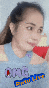 a woman in a blue top with the words omg ratu live written on the bottom