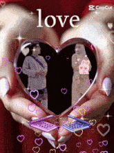 a couple of hands holding a heart with the word love above them