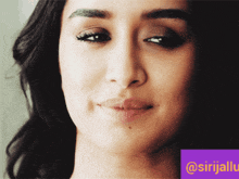 a close up of a woman 's face with a purple border that says @srijalu