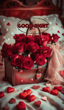 a bouquet of red roses is on a bed with hearts and the words good night