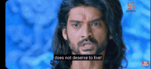 a man with long hair and a beard says does not deserve to live