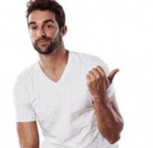 a man with a beard is wearing a white shirt and giving a thumbs up sign .