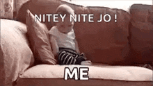 a baby is sitting on a couch with a caption that says `` nitey nite jo ! ''