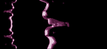 a close up of a woman 's mouth with purple lipstick on