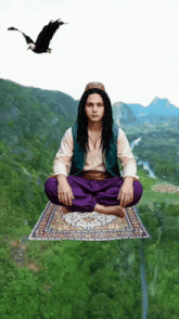 a man with dreadlocks sits on a flying rug with a bird flying overhead