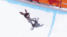 a cartoon rabbit is riding a snowboard down a snowy hill