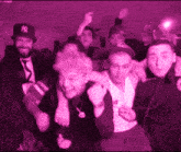 a group of people are posing for a picture and one of them has a ny hat on