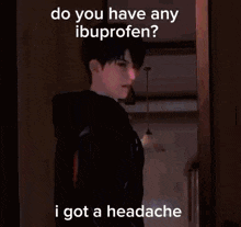 a person is asking if they have any ibuprofen while holding a cell phone .