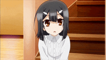 a girl with horns on her head is sitting on a set of wooden stairs