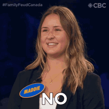 a woman wearing a name tag that says maddie says no