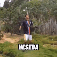 a man in an all jersey is standing in a field