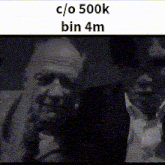 a black and white photo of two men with the words c / o 500k bin 4m on the bottom