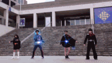 a group of people are dancing in front of a building that has the word square on it