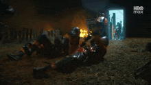 a group of soldiers are in a room with a hbo logo in the corner