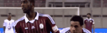 a soccer player wearing a jersey that says ram on it