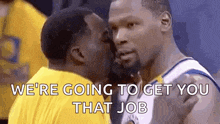 two basketball players are kissing each other on the cheek while talking to each other .