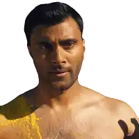 a shirtless man with yellow paint splattered on his chest