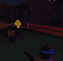 a blurred image of a person standing in a dark room with a light in the background
