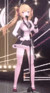 a girl in a dress is singing into a microphone on a stage .