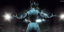 a statue of a monster with the name arta juan on the bottom