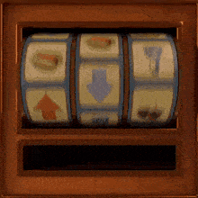 a slot machine is spinning in a wooden box with a few pictures on it .