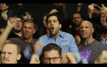 a man in a blue shirt with u.s.a.n.d. written on it