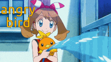 a girl is holding a stuffed animal and the words " angry bird " are behind her