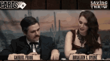 gabriel prior and rosaleen s. byrne are sitting at a table in front of a desert background