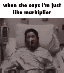 a man is laying in a hospital bed with an oxygen mask on .