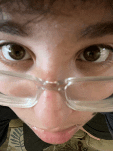 a close up of a person wearing glasses