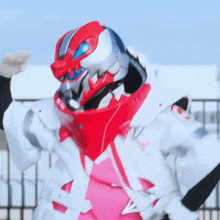 a person wearing a red and white helmet and a pink shirt