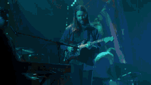 a blurred image of a man in a blue shirt with the number 11 on it