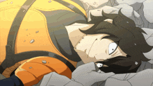 a cartoon character is laying on a pile of rocks and has a white eye
