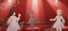 three anime girls are dancing on a stage with the words hey written around them