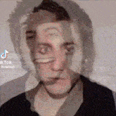 a tiktok video of a man 's face is being posted
