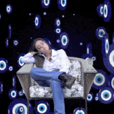 a woman is sitting in a chair with her legs crossed