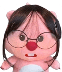 a stuffed animal with glasses and a red nose