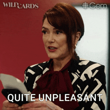 a woman holding a piece of paper with the words quite unpleasant below her