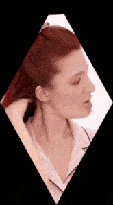 a woman with red hair is in a diamond shaped frame
