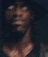 a man wearing a hat and a shirt that says ' pacers ' on it
