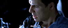 a close up of a man 's face with the words `` blow me '' written on his face .